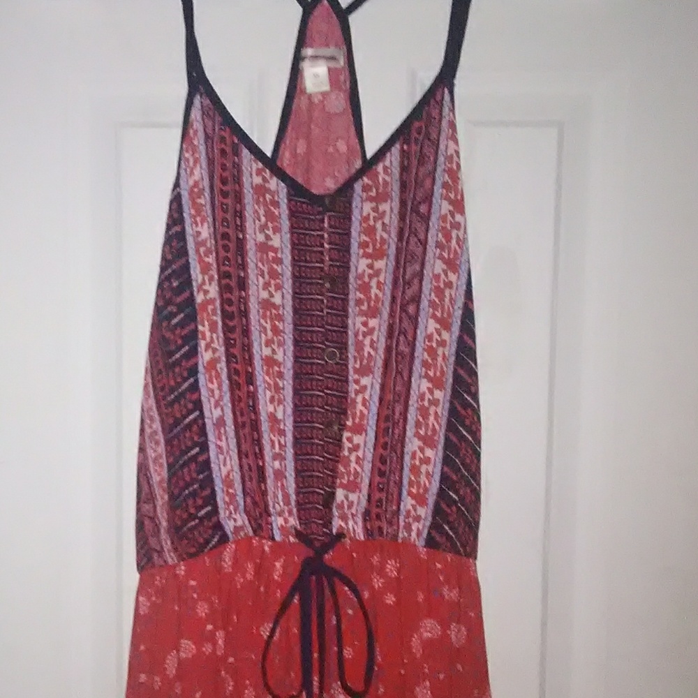 Patter jumpsuit with fabric hanging around waist